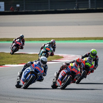 Motorcycle racers on a track during a race, dynamic action shot